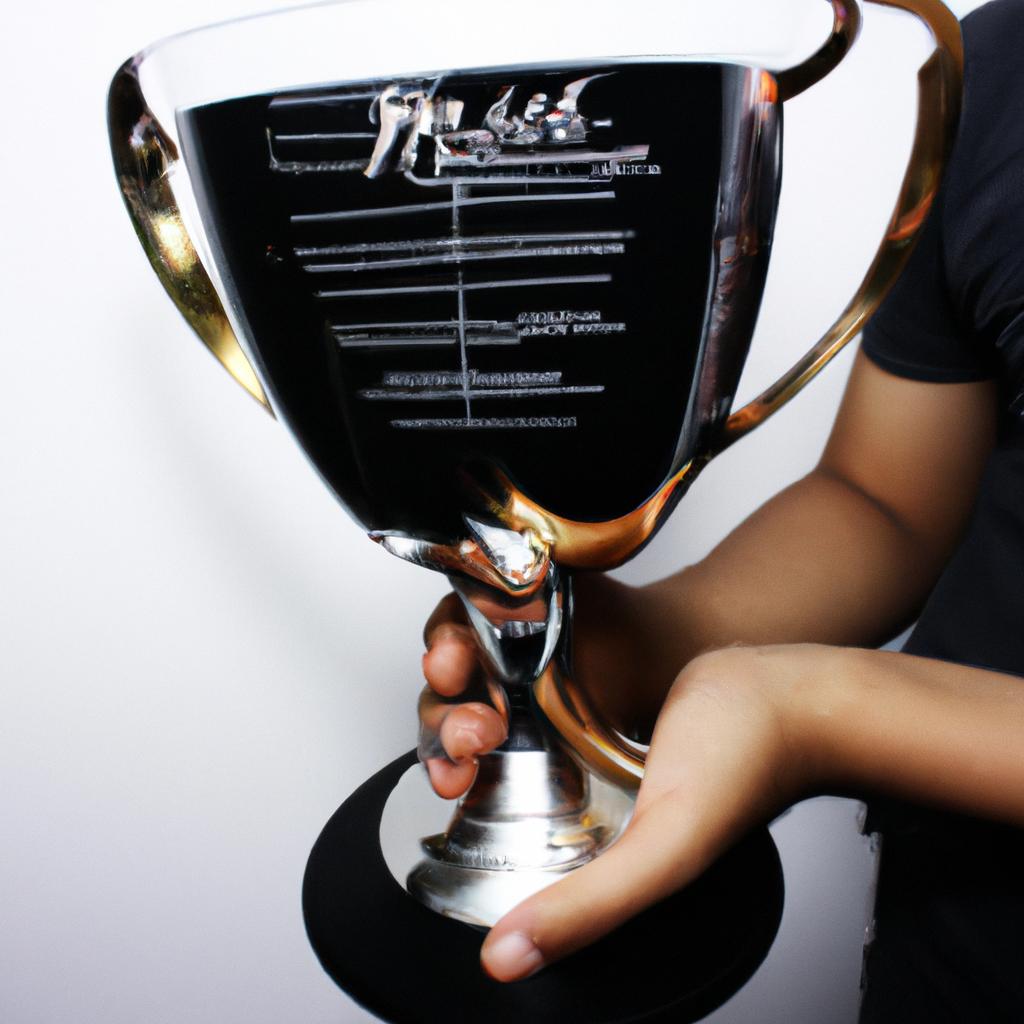 Person holding a music trophy